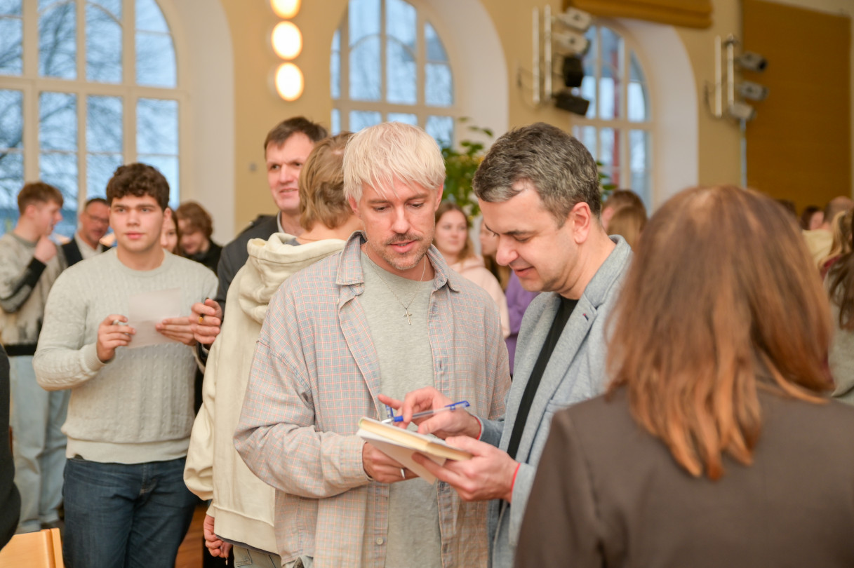 People meeting and talking at an indoor event
